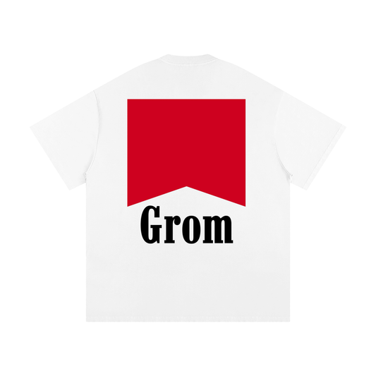 White t-shirt with a red logo and 'Grom' text on a white background
