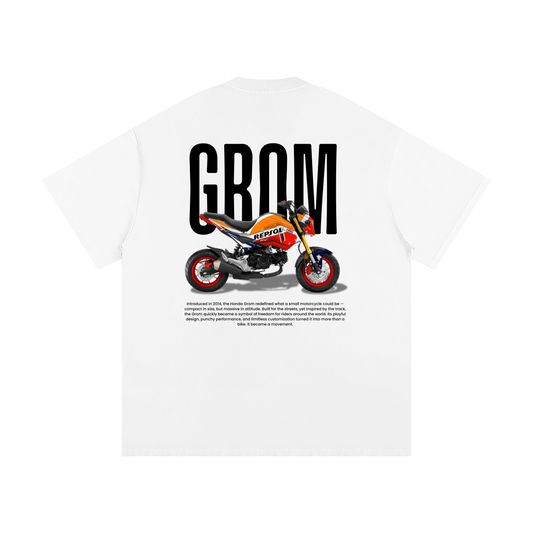White t-shirt with a graphic of a motorcycle and 'GROM' text on a white background